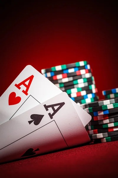 Teen Patti cards and betting chips on table